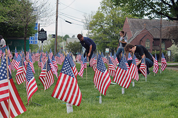 Volunteers placed over 300 flags in precise lines on the front lawn at Jones Memorial Hospital during the 2015 Field of Flags.