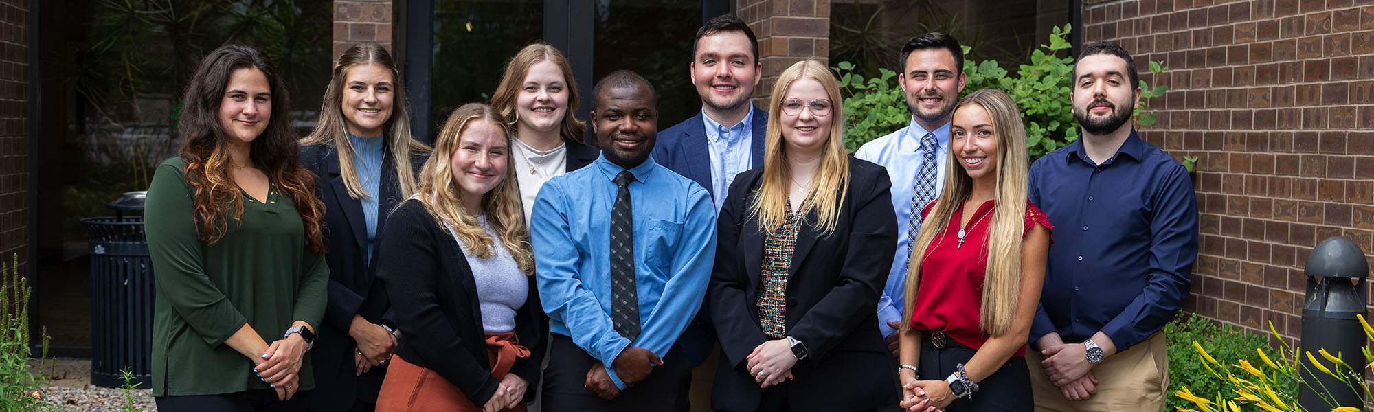 Group of pharmacy residents standing in front of a building