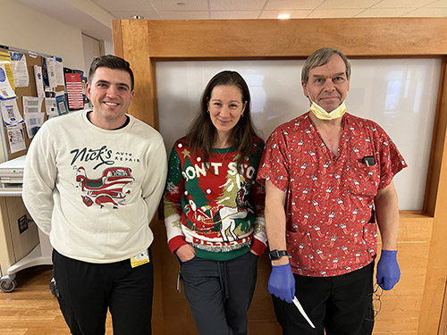 Pulmonary team model ugly holiday sweaters