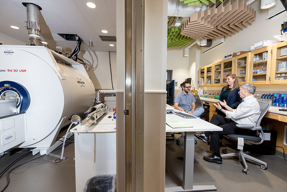 From Left: Paul Geha, Jennifer Gewandter, and Eli Eliav, discuss data collected by 9.4 Tesla magnet in CABIN. Test