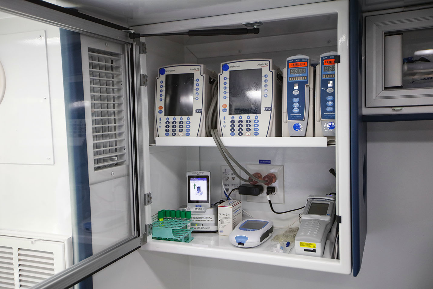 Interior of Mobile Stroke Unit showing a cabinet of medicines available to administer to the patient immediately.